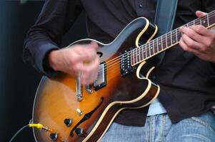 Man is playing guitar photo