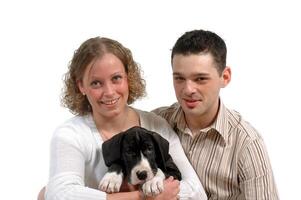 Young couple and puppy photo