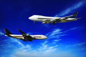 Two jumboes and blue sky photo