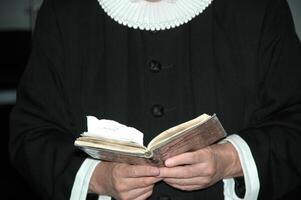 Priest and bible photo
