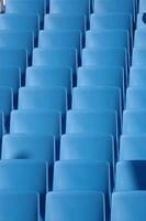 Rows of blue chairs photo