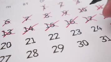 timelapse calendar close-up dates are crossed out with a red marker video