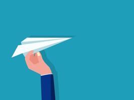 a hand holding a paper airplane in the air vector