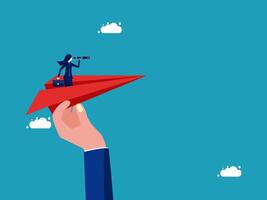 hand holding a paper airplane with a person on it vector