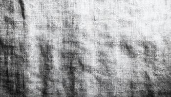 Abstract textile pattern on old-fashioned denim backdrop. generated by AI photo