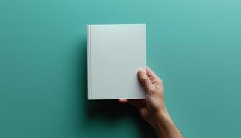 Hand holding book, page of empty literature space generated by AI photo