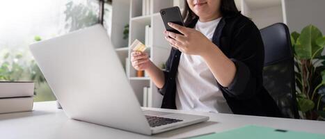 Consumer Using Smartphone and Laptop for Secure Online Shopping photo