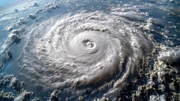 A massive cyclone spins above the ocean, casting shadows on turbulent waters photo