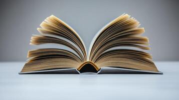 An inviting book lies open, its pages fanned out, ready to share stories and knowledge photo