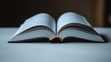 The book lies open on a table, beckoning readers to delve into its captivating content photo