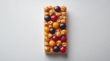 A delicious snack bar featuring a mix of flavored popcorn and assorted fruits photo