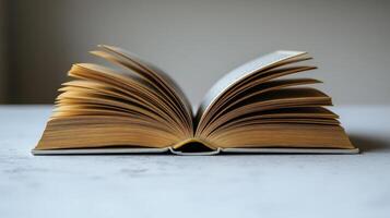 An intriguing book lies open, showcasing its yellowed pages and inviting stories within photo