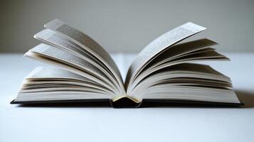 A well-worn book lies open, its pages fanned out, inviting readers to dive into its world photo