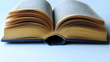 The pages of a weathered book lie open, inviting readers to discover its secrets photo