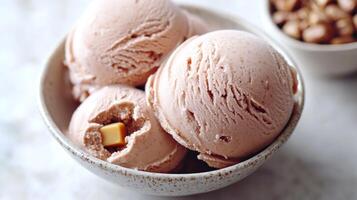Enjoying delightful strawberry ice cream with gooey caramel hidden within photo