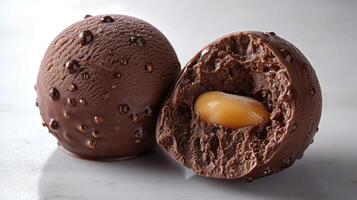 Tempting chocolate truffles reveal a rich and creamy caramel center, inviting indulgence photo