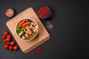 Colorful vegan vegetarian dish consists of tofu, broccoli, quinoa, mushrooms photo