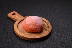 Delicious colorful asian mochi sweets with rice dough shell and fruit filling photo