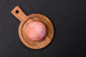 Delicious colorful asian mochi sweets with rice dough shell and fruit filling photo