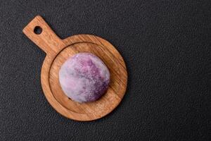 Delicious colorful asian mochi sweets with rice dough shell and fruit filling photo