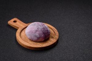 Delicious colorful asian mochi sweets with rice dough shell and fruit filling photo