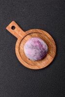 Delicious colorful asian mochi sweets with rice dough shell and fruit filling photo