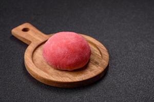Delicious colorful asian mochi sweets with rice dough shell and fruit filling photo