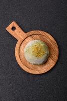 Delicious colorful asian mochi sweets with rice dough shell and fruit filling photo