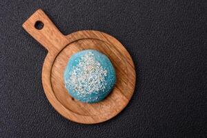 Delicious colorful asian mochi sweets with rice dough shell and fruit filling photo