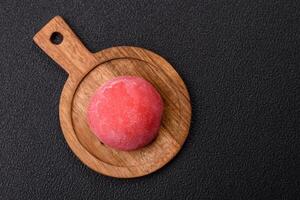 Delicious colorful asian mochi sweets with rice dough shell and fruit filling photo