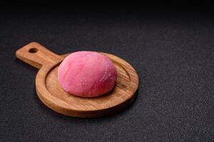 Delicious colorful asian mochi sweets with rice dough shell and fruit filling photo