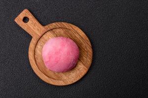 Delicious colorful asian mochi sweets with rice dough shell and fruit filling photo