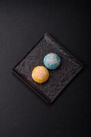 Delicious colorful asian mochi sweets with rice dough shell and fruit filling photo