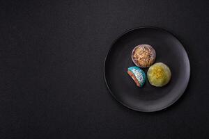 Delicious colorful asian mochi sweets with rice dough shell and fruit filling photo