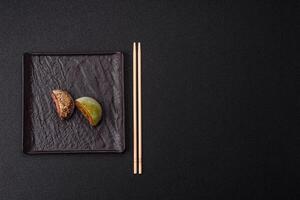Delicious colorful asian mochi sweets with rice dough shell and fruit filling photo