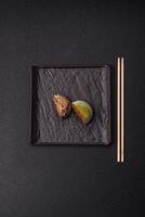 Delicious colorful asian mochi sweets with rice dough shell and fruit filling photo