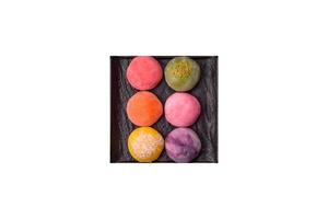Delicious colorful asian mochi sweets with rice dough shell and fruit filling photo