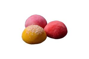 Delicious colorful asian mochi sweets with rice dough shell and fruit filling photo