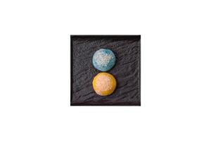 Delicious colorful asian mochi sweets with rice dough shell and fruit filling photo