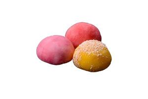 Delicious colorful asian mochi sweets with rice dough shell and fruit filling photo