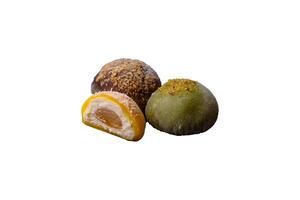Delicious colorful asian mochi sweets with rice dough shell and fruit filling photo