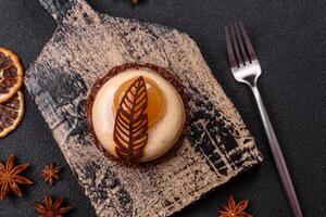 Sweet tart with pear lemon mousse cream and chocolate cake base photo