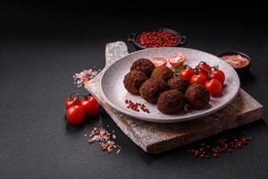 Falafel vegetarian and vegan dish made with chickpeas, spices and herbs photo