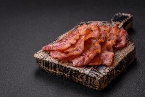 Delicious crispy bacon grilled with salt and spices photo