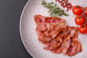 Delicious crispy bacon grilled with salt and spices photo