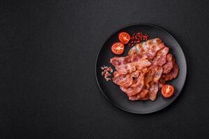 Delicious crispy bacon grilled with salt and spices photo