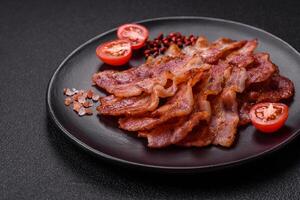 Delicious crispy bacon grilled with salt and spices photo