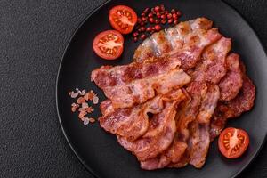 Delicious crispy bacon grilled with salt and spices photo
