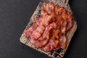 Delicious crispy bacon grilled with salt and spices photo