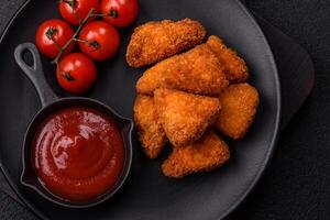 Brie cheese or camembert fries in breading, fast food, takeaway photo